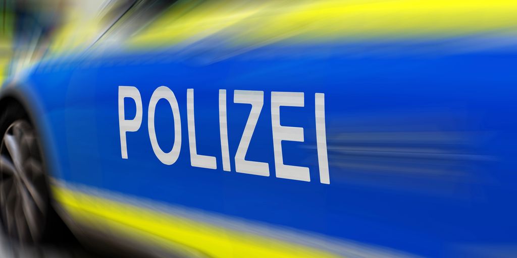 Image of a police car with blue and yellow colors.